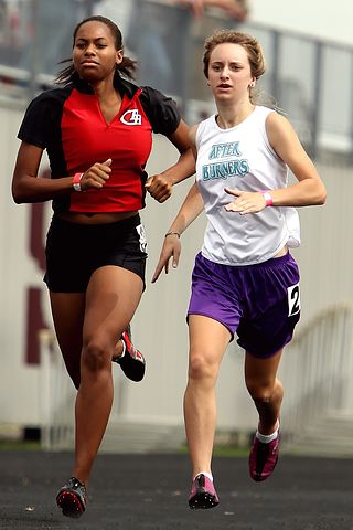 Two athletes running together